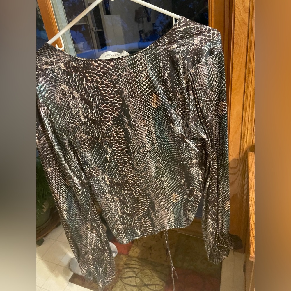 Silk Saint Laurent. It’s gorgeous, I’ve never worn it, and I’ve out grown it.